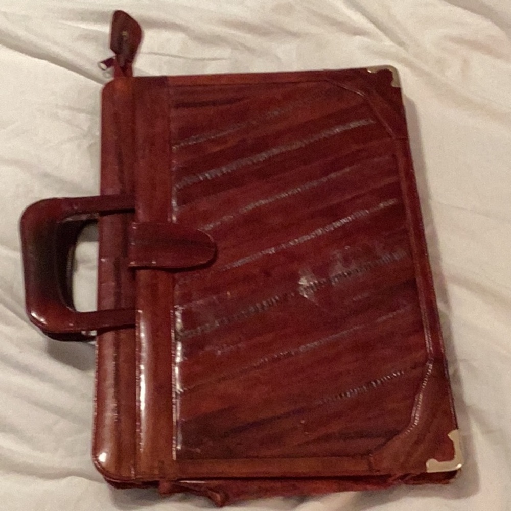 Set of Eel-skin briefcase, checkbook cover, small purse sizeKleenex holder.